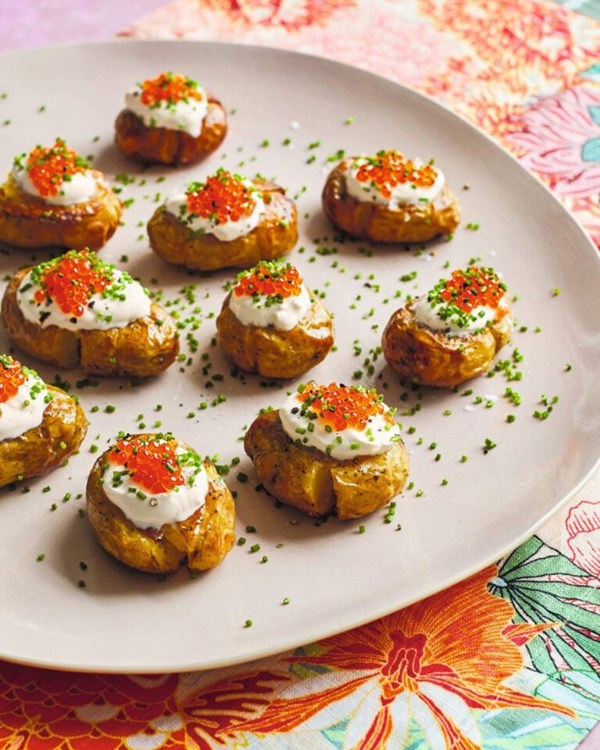 Smashed potatoes with crème fraîche, chives and roe