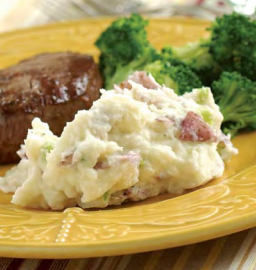 Smashed red-skinned potatoes with Boursin and scallions
