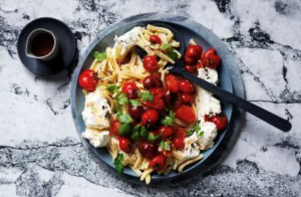 Smashed tomato and black garlic labneh pasta salad