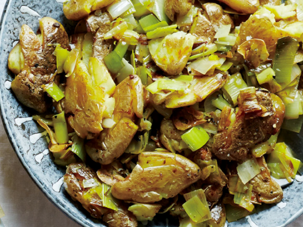 Smashed twice-cooked potatoes with leeks and green garlic