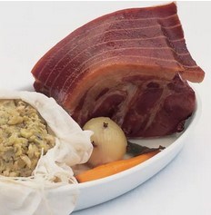 Smoked collar of bacon with pease pudding and creamy onion mustard sauce