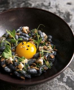 Smoked eel carbonara with squid ink cavatelli and toasted pumpkin seeds