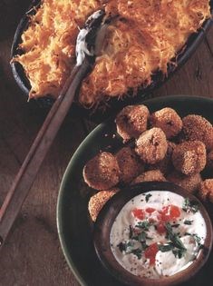 Smoked fish and sesame balls with tomato sauce