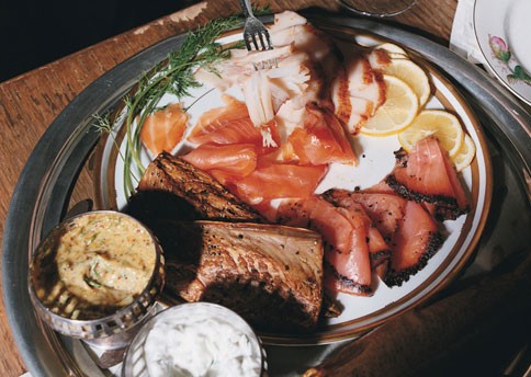 Smoked fish platter with honey-mustard dill sauce and cucumber-coriander yogurt