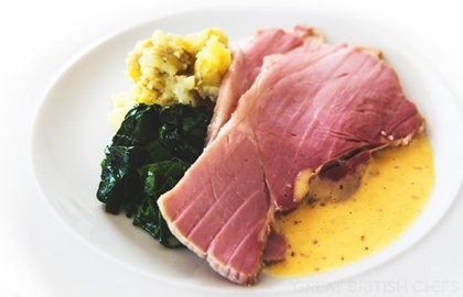 Smoked gammon baked in bran with crushed potatoes, poached egg, grain mustard dressing