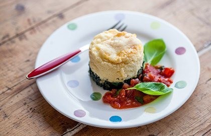 Smoked haddock soufflé with tomato, pepper and olive sauce