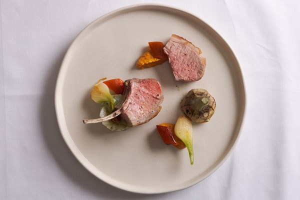 Smoked lamb rack with artichokes and romesco sauce