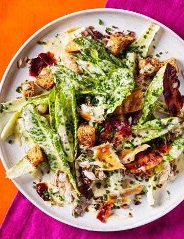 Smoked mackerel Caesar salad with crispy onions and seedy croutons