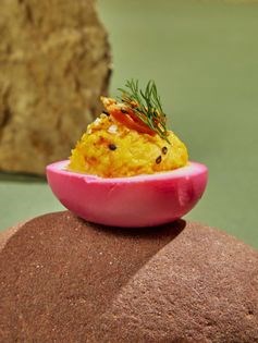 Smoked salmon deviled eggs with black sesame seeds