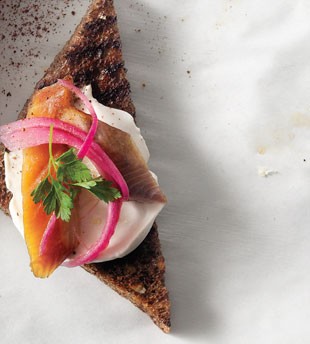 Smoked trout, crème fraîche & pickled onion on pumpernickel