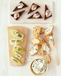 Smoked trout, crème fraîche, and pickled onions on pumpernickel