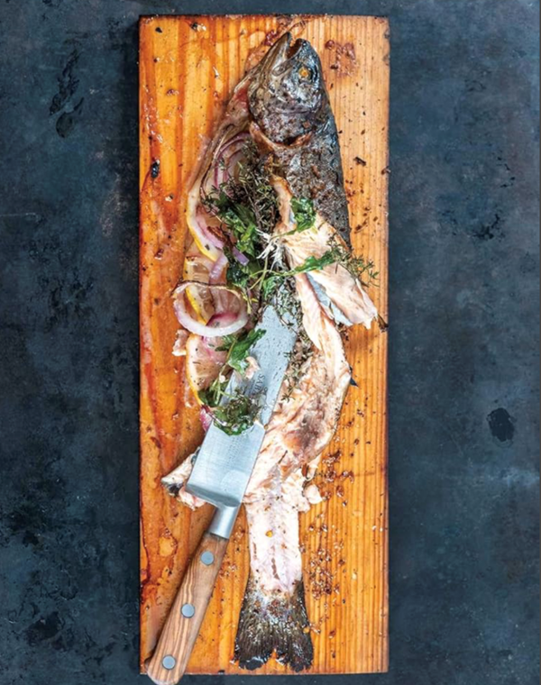 Smoked trout stuffed with herbs