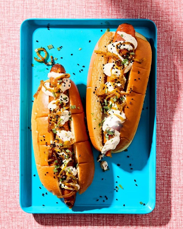 Smoky BBQ carrot dogs with charred spring onion crème fraîche and curried onions