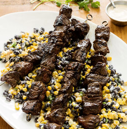 Smoky beef skewers with corn and black bean salad