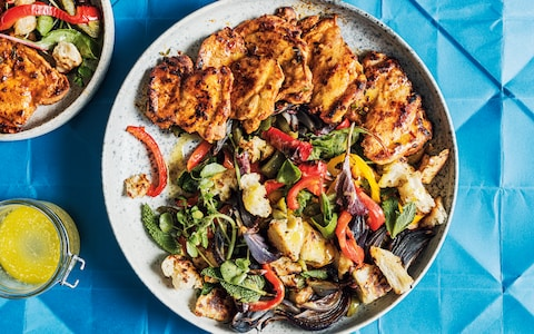 Smoky chicken thighs with migas, roasted peppers and almonds