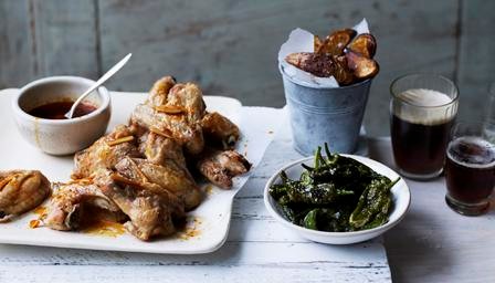 Smoky chilli chicken wings, spiced potato wedges and padrón peppers