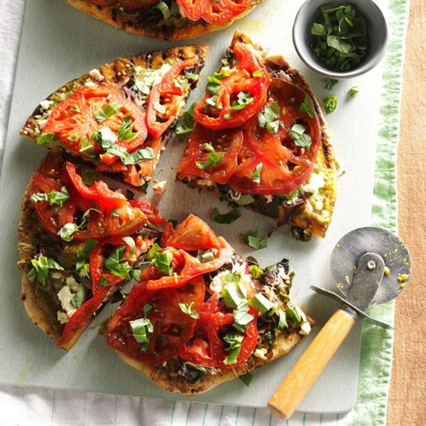 Smoky grilled pizza with greens & tomatoes