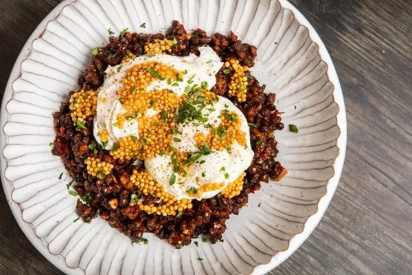 Smoky harissa lentils with poached eggs and pickled mustard seeds
