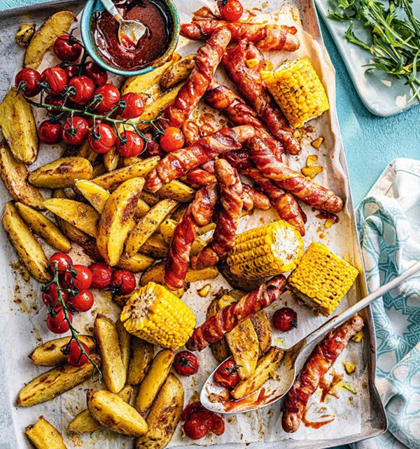 Smoky pigs-in-blankets traybake
