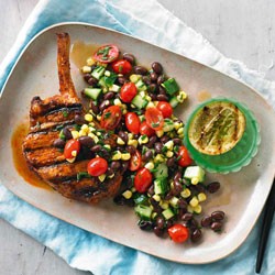 Smoky pork cutlets with corn, black bean and cucumber salad