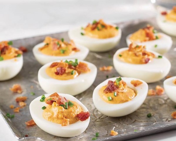 Smoky red deviled eggs and bacon