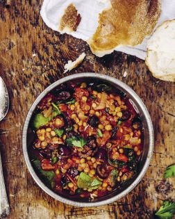 Smoky tomato lentil soup with spinach and olives