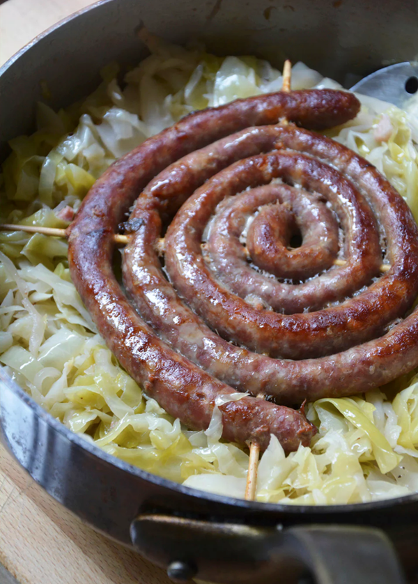 Smothered cabbage with sausages