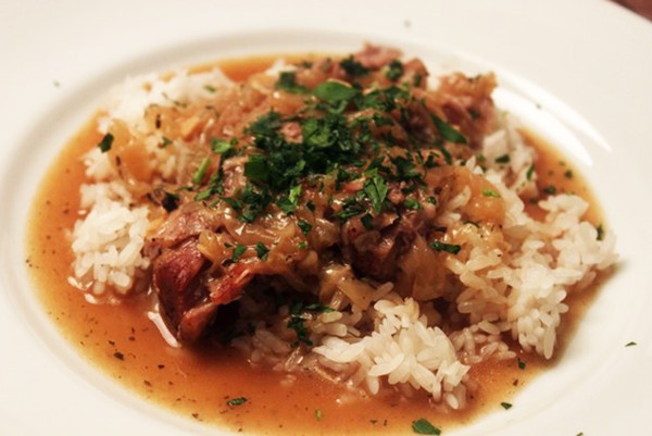 Smothered pork roast over rice