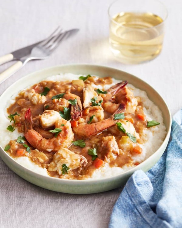 Smothered shrimp and crabmeat pan gravy with stone-ground grits