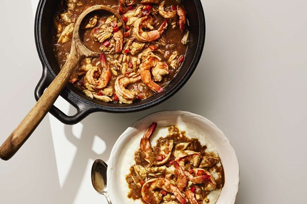 Smothered shrimp and crabmeat pan gravy with rice grits