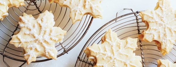 Snowflake sandwich cookies with peppermint buttercream filling