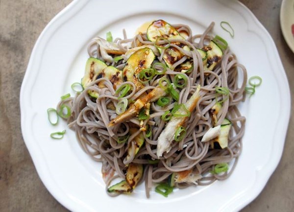 Soba salad with hot smoked mackerel, spring onions, courgettes