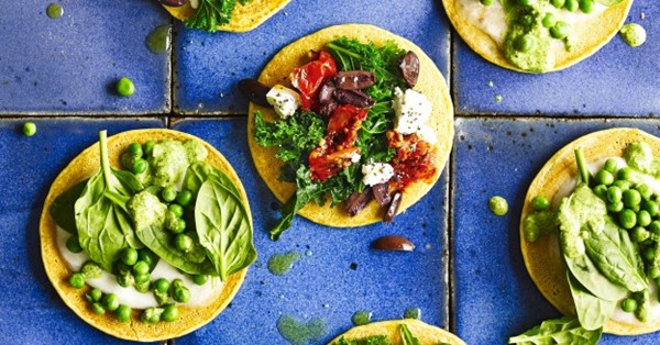 Socca pizza with kale and olive topping