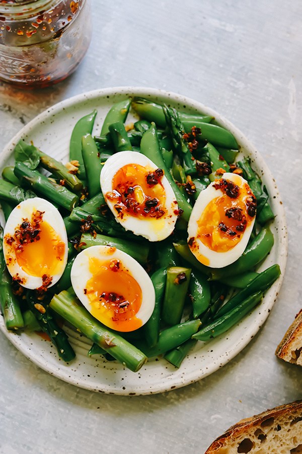 Soft-boiled eggs with asparagus and snap peas with peanuts and basil