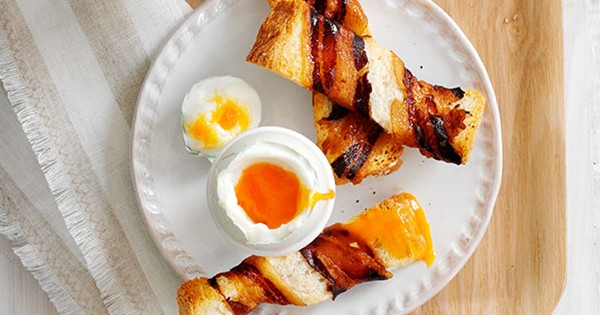 Soft-boiled eggs with pancetta wrapped soldiers