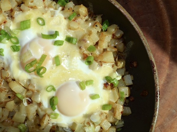 Soft-cooked eggs on cheesy skillet hash