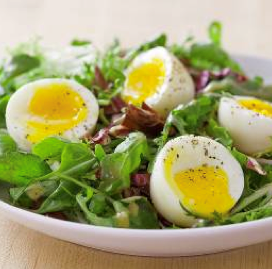 Soft-cooked eggs with salad