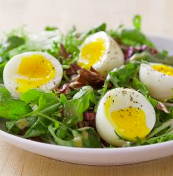 Soft-cooked eggs with salad
