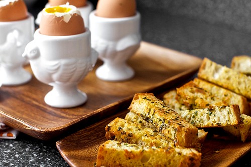 Soft eggs with buttery herb-Gruyère toast soldiers