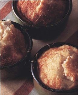 Soft goats’ cheese soufflés on a fresh tomato base
