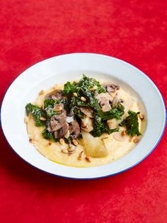 Soft polenta with garlic field mushrooms and kale
