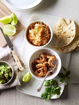 Soft prawn tacos with coleslaw, avocado and coriander