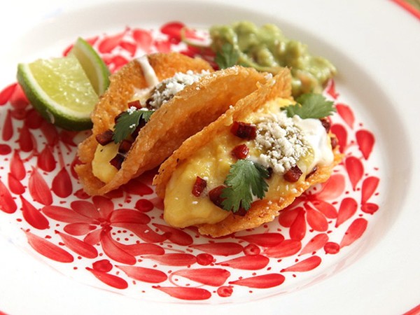 Soft scrambled egg and chorizo in crispy all-cheese taco shells