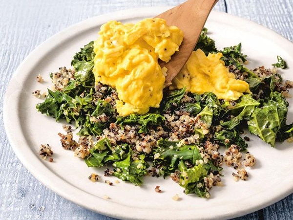 Soft scrambled eggs with kale and crispy quinoa
