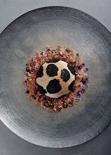 Soft truffle meringue with truffle ice cream, macadamia nut praline, rosemary and malt