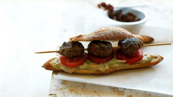 Sosatie burgers with peanut curry chiffonade, and apricot and red onion chutney