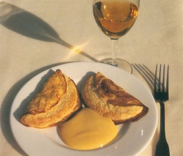 Souffleed crepes with almonds and sabayon sauce