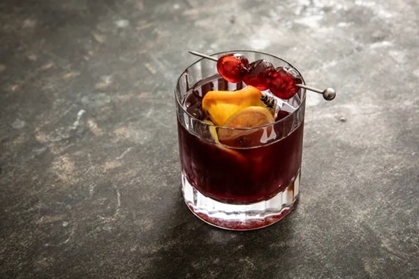 Sour cherry old fashioned with citrus and thyme ice