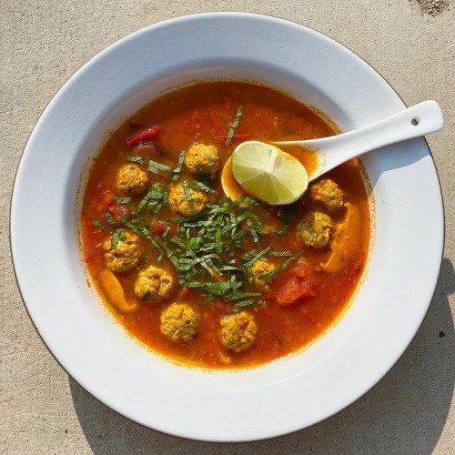 Sour tomato and lemongrass soup with little pork meatballs