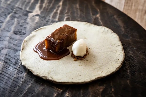 Sourdough bread pudding with double cream ice cream, salted coffee caramel